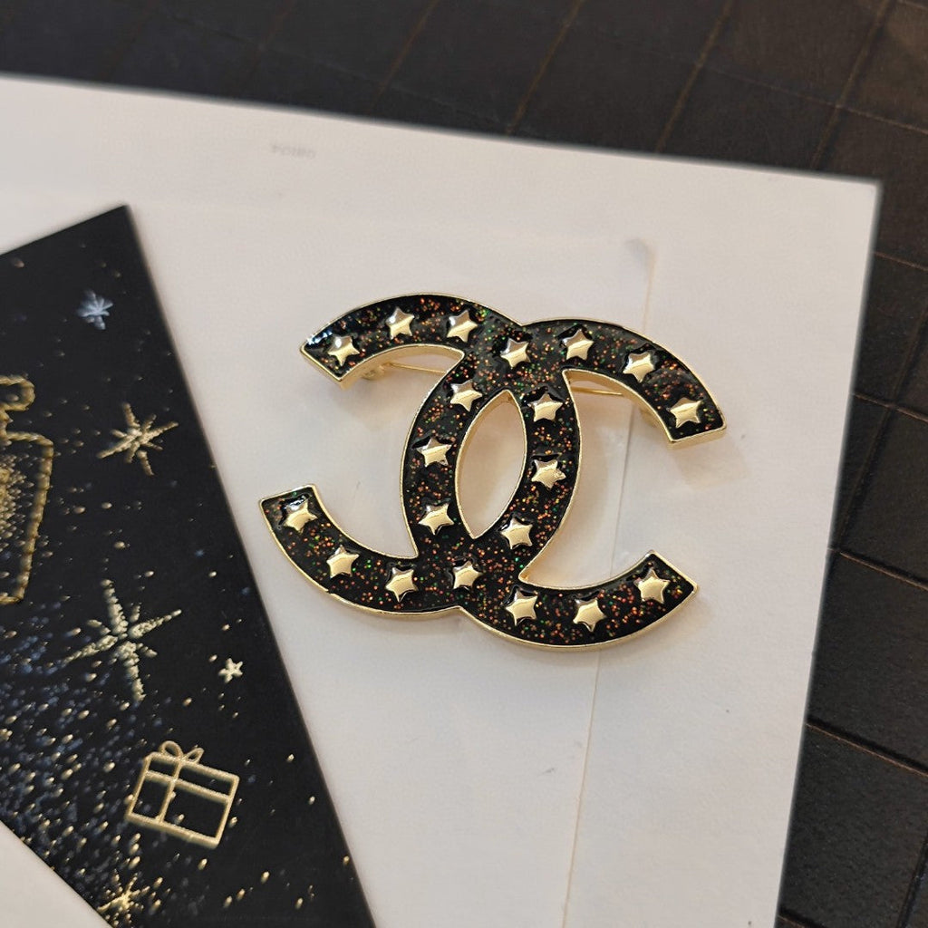 Chanel Black Star 18K Gold Brooch